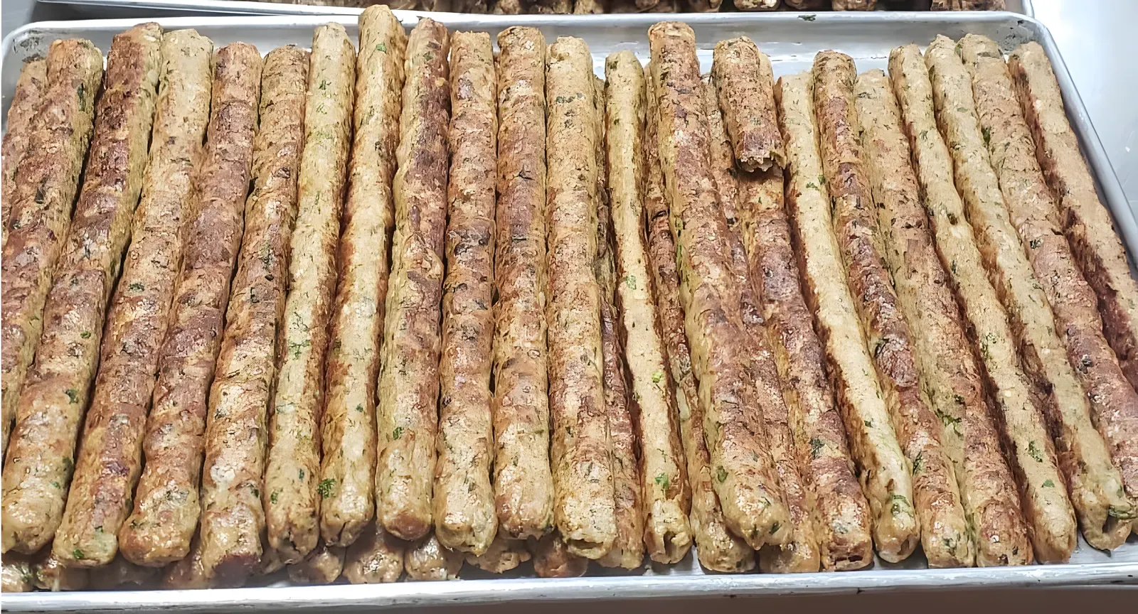 Tray of seekh kabobs fresh off the grill